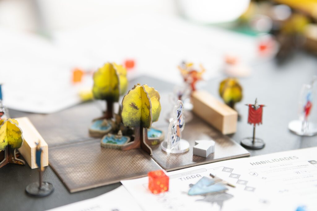 A tabletop role-playing game setup with miniatures and dice, representing the shared story that emerges during play.